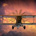 GRCC March 2021 Digital Competition Photo Gallery  A Flyover RandyNyhof.jpg  Loud Planes Fly Low with a Biplane with Brilliant Storm Clouds at Sunset No.3836 A Fine Art Aviation Photographic Image : plane, airplane, flight, fly, retro, travel, biplane, aviation, propeller, prop, transport, vintage, aircraft, old, design, transportation, air, sky, tourism, pilot, aeroplane, aviator, wing, airshow, aerial, airfield, adventure, trip, engine, airborne, flying, storm, clouds, cloudy, spectacular, day, yellow, orange, sunset, Art, Photography, Photograph, Fine Art, color, colour, randy nyhof, randall Nyhof, Nyhof